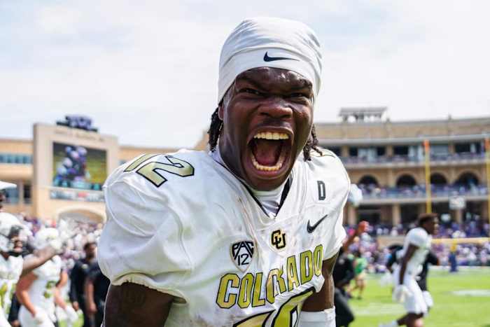 Travis Hunter celebrates on the field after win over TCU